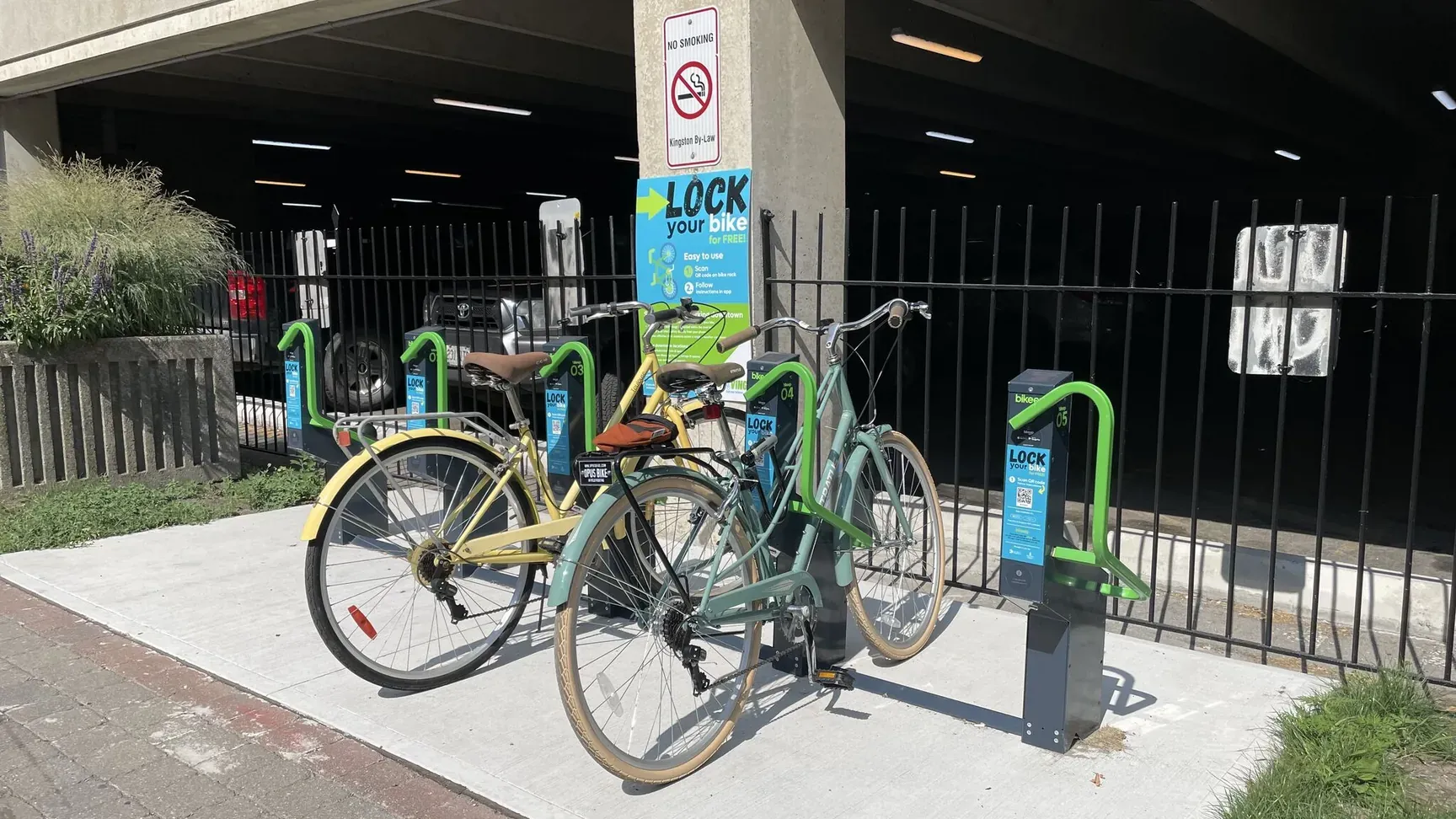 Row of Bikeep secure bike parking docks in the park across from Kingston City Hall on Ontario Street